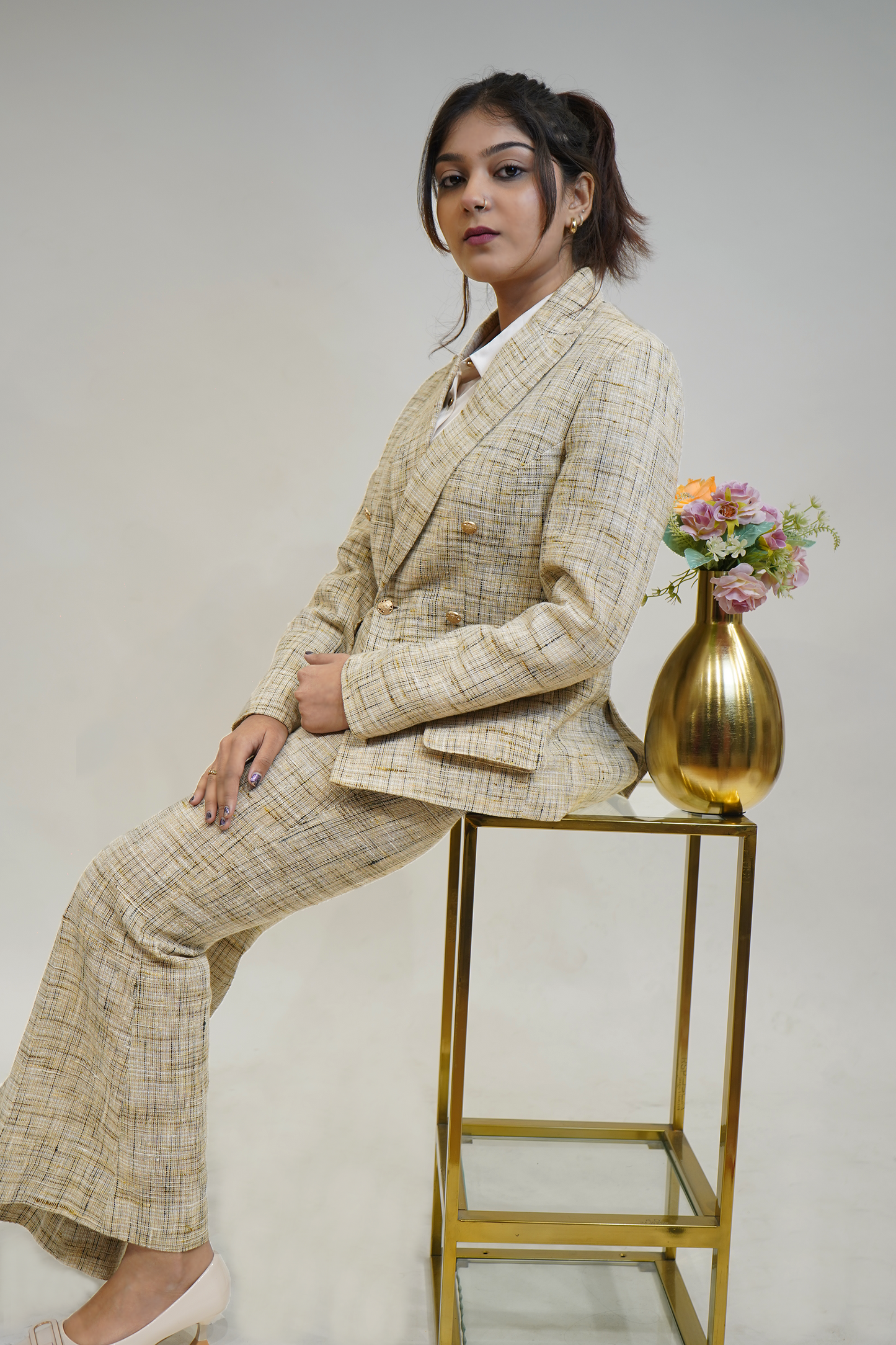 Cream self textured linen based 2 piece double breasted blazer trouser set.
